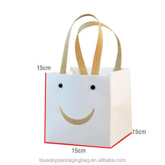 OEM/ODM Customized Logo Printed Smiling Face Paper Gift Bags Personalized Paper Carry Bags Handle Paper Bags for Daily Party