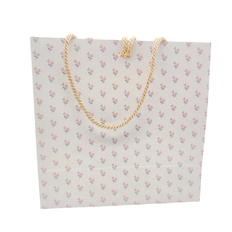 Wholesale Customized Logo Art Paper Shopping Bag Packaging Kraft Paper Bag Embossed Logo for Clothing Lamination Printing