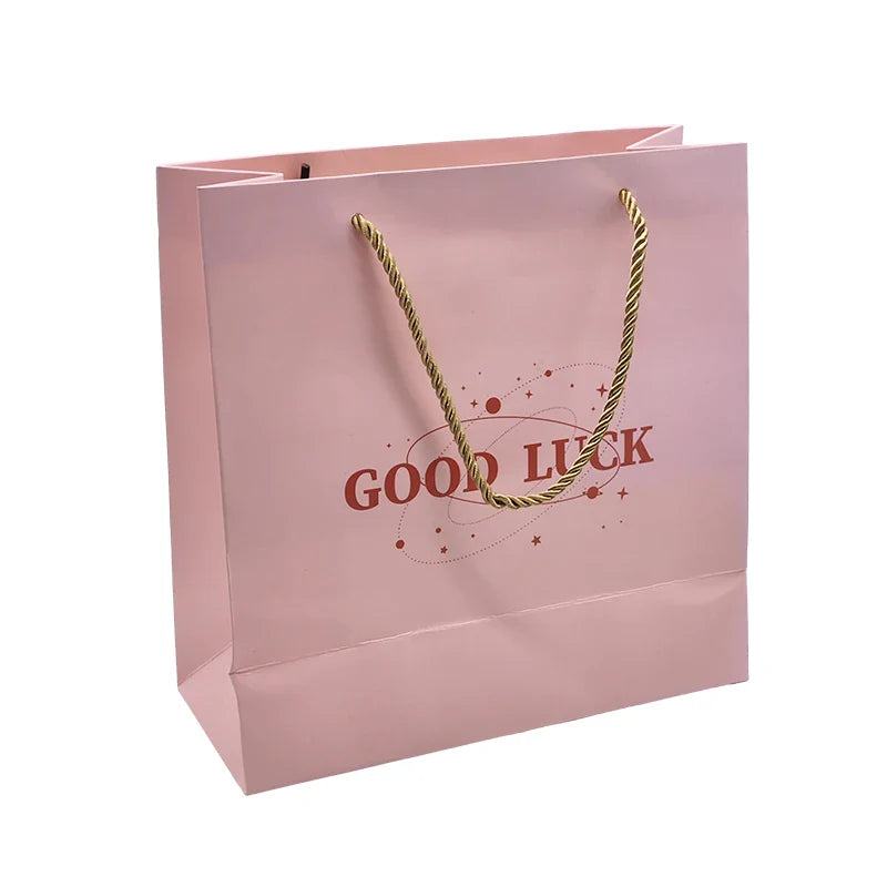 Wholesale Customized Logo Art Paper Shopping Bag Packaging Kraft Paper Bag Embossed Logo for Clothing Lamination Printing