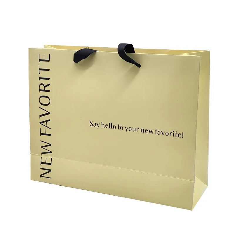Wholesale Customized Logo Art Paper Shopping Bag Packaging Kraft Paper Bag Embossed Logo for Clothing Lamination Printing